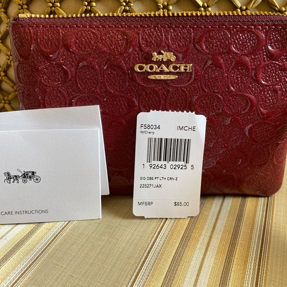 Coach signature zip around wrislet